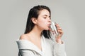 Girl drinking water glass. Beautiful young woman with clean fresh skin. Royalty Free Stock Photo