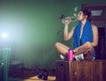 Girl drinking water after gym training Royalty Free Stock Photo