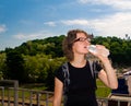 Girl drinking water outdoors Royalty Free Stock Photo