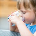 Girl drinking water outdoors Royalty Free Stock Photo