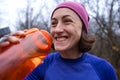 Girl drinks water after jogging Royalty Free Stock Photo