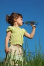 Girl drinks water from plastic bottle Royalty Free Stock Photo