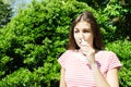 Girl drips blocked nose from allergy. Woman with Respiratory Spray for nose in Spring Blooming. Portrait of a woman having respira Royalty Free Stock Photo