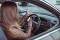 Girl driving car in cabin. Hand gesture accident horn signal, beep, conflict, emotion stress aggression discontent