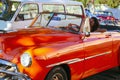 Girl driving old car in Havana, Cuba Royalty Free Stock Photo