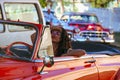 Girl driving old car in Havana, Cuba Royalty Free Stock Photo