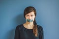 Girl with duct tape over her mouth Royalty Free Stock Photo