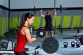 Girl dumbbell and man weight lifting bar workout Royalty Free Stock Photo