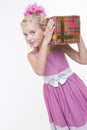 Girl is eager to open a gift Royalty Free Stock Photo