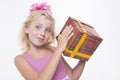 Girl is eager to open a gift Royalty Free Stock Photo