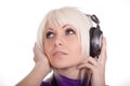 The girl in ear-phones listens to music Royalty Free Stock Photo