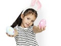 A girl with an easter eggs and bunny hairband Royalty Free Stock Photo