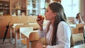 Girl eat apples in class during recess. Royalty Free Stock Photo