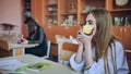 Girl eat apples in class during recess. Royalty Free Stock Photo