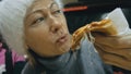 Girl eat pizza cheese four. Close up of young woman mouth greedily eating pizza and chewing in outdoor restaurant. Junk