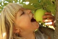 Girl Eating Apple in Tree Royalty Free Stock Photo
