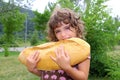 Girl eating big bread humor size hungry child Royalty Free Stock Photo