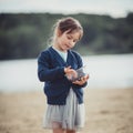 The girl eating blueberries from a glass bowl Royalty Free Stock Photo