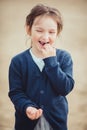 The girl eating blueberries from a glass bowl Royalty Free Stock Photo