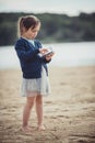 The girl eating blueberries from a glass bowl Royalty Free Stock Photo