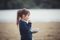 The girl eating blueberries from a glass bowl Royalty Free Stock Photo