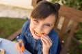 Girl Eating Healthy Carrots Outdoors