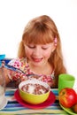 Girl eating chocolate cornflakes Royalty Free Stock Photo