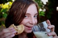 Girl eating cookies and milk Royalty Free Stock Photo