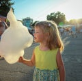 Girl eating cotton candy Royalty Free Stock Photo