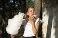 Girl eating cotton candy Royalty Free Stock Photo