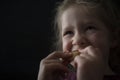 Girl eating a crumpet