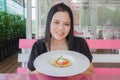 Girl eating Custard caramel