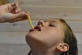 Girl eating delicious fast food hamburger with fries