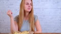 Girl eating french fries and smiling