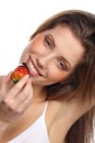 Girl eating a fresh red strawberry Royalty Free Stock Photo