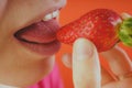 Girl eating fresh strawberries, close-up Royalty Free Stock Photo