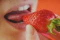 Girl eating fresh strawberries, close-up Royalty Free Stock Photo