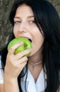 Girl eating green apple Royalty Free Stock Photo