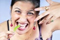 Girl eating green chilly Royalty Free Stock Photo