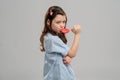 Girl eating a hard candy