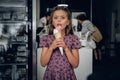 A girl eating ice cream in a cafe. Royalty Free Stock Photo