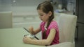 Girl eating ice cream in the kitchen