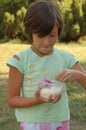 Girl eating ice cream from tub