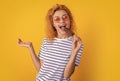 girl eating icelolly ice cream at summer. girl with icelolly ice cream isolated on yellow. girl with icelolly ice cream