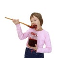 Girl eating jam from the jar Royalty Free Stock Photo