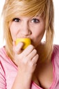 Girl eating lemon