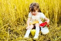 Girl eating a long loaf and milk Royalty Free Stock Photo