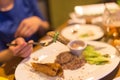 Girl eating meat with salad in a restaurant Royalty Free Stock Photo