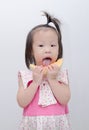 Girl eating melon over white background