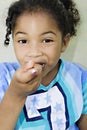 Girl eating a pice of cake/food